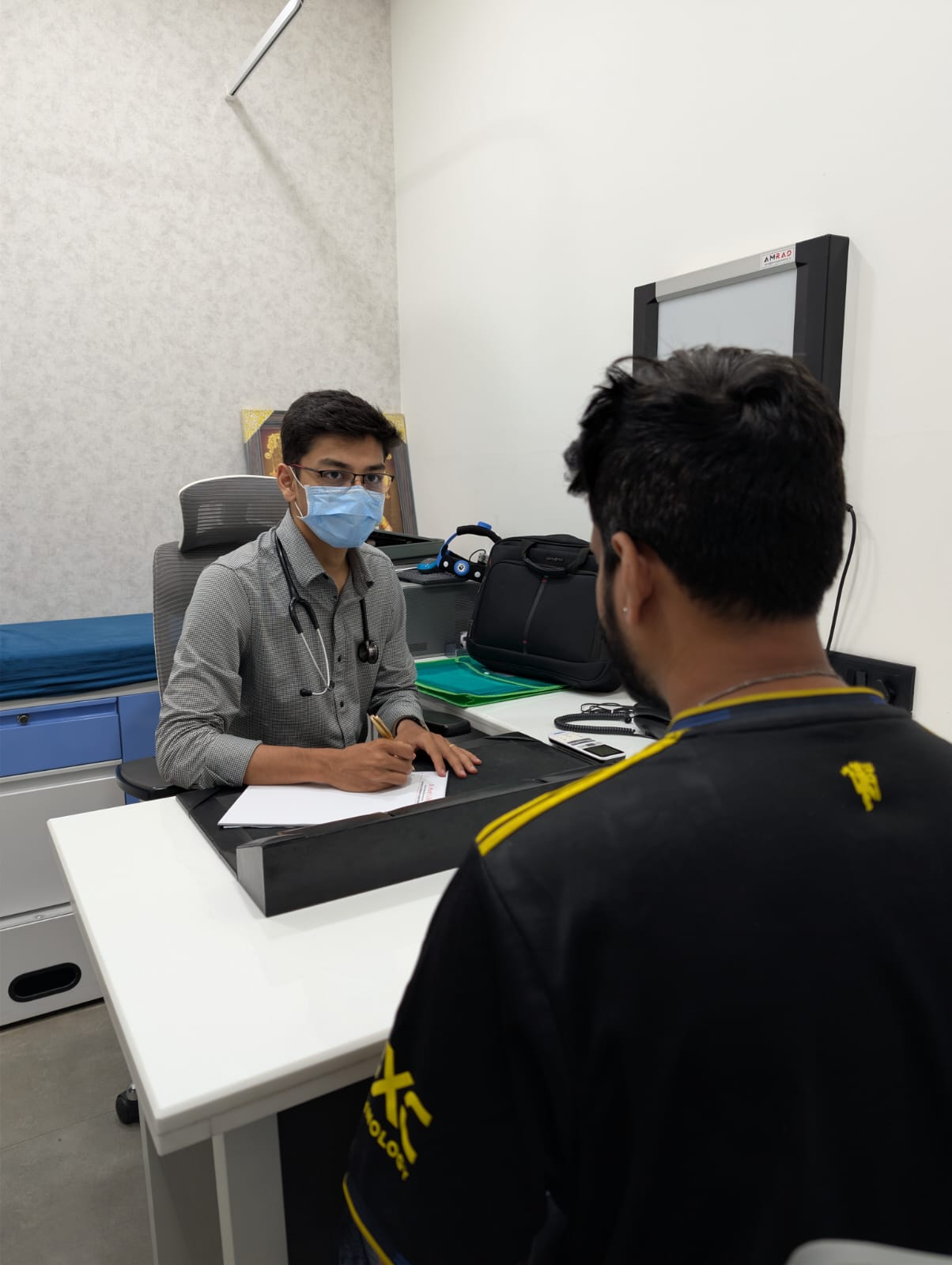 Dr. Pratik Chhajed in consultation with a patient at his clinic